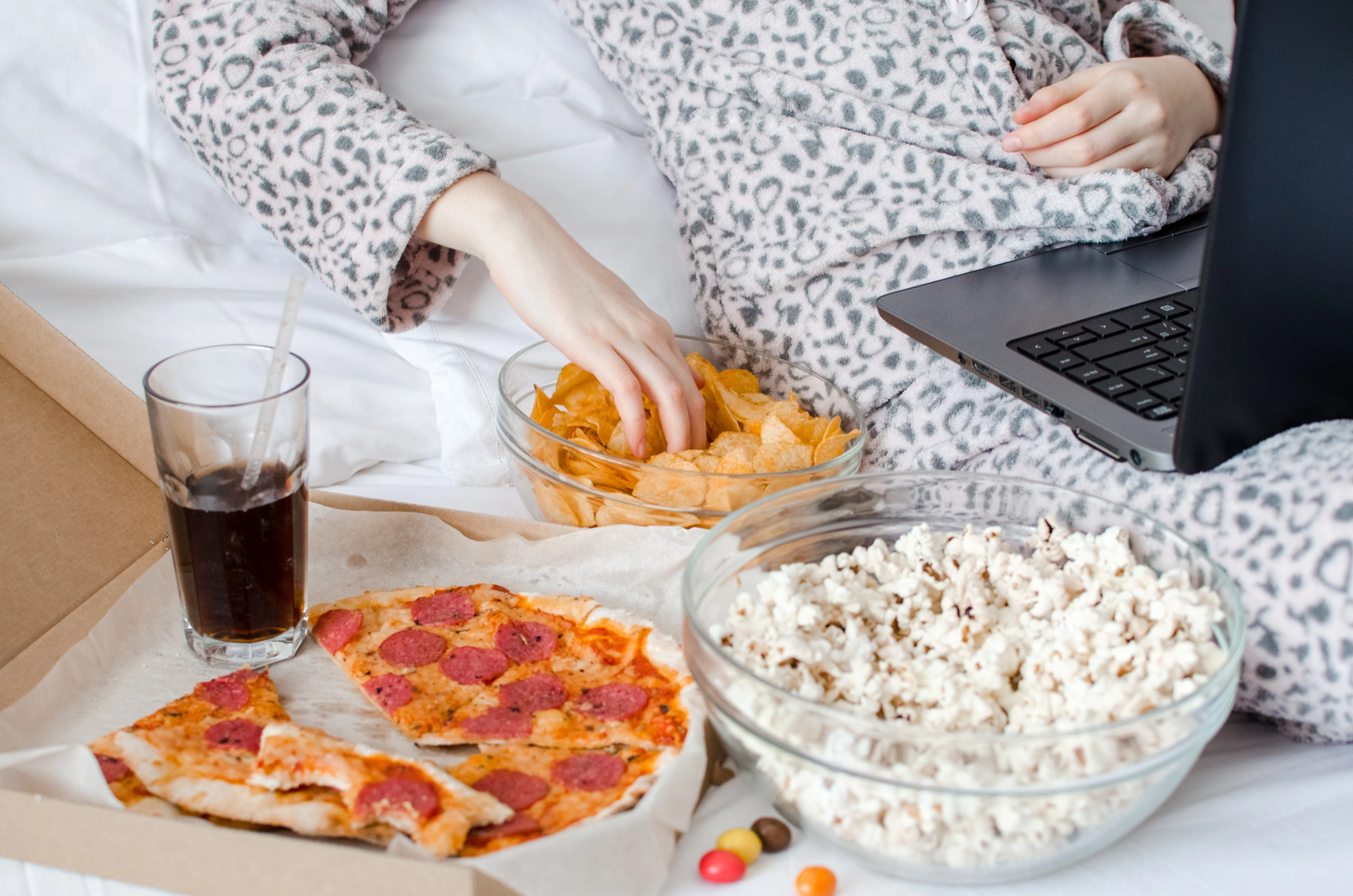 Photo of someone eating many snacks